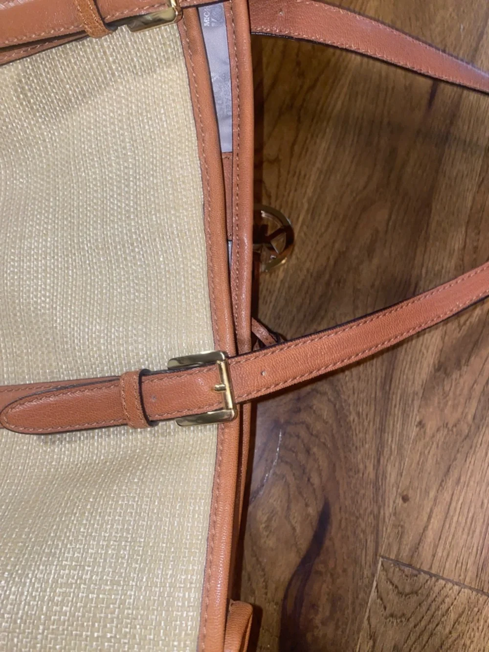 Michael Kors Raffia Tote with Tan Leather Trim and handles.